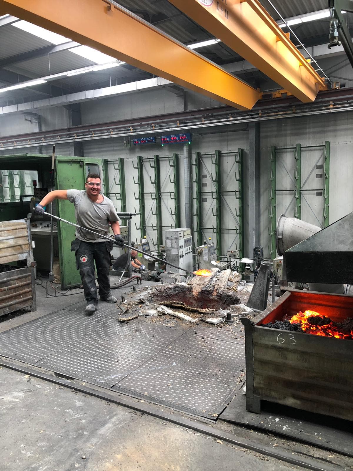 Technician cleaning a furnace and removing slag